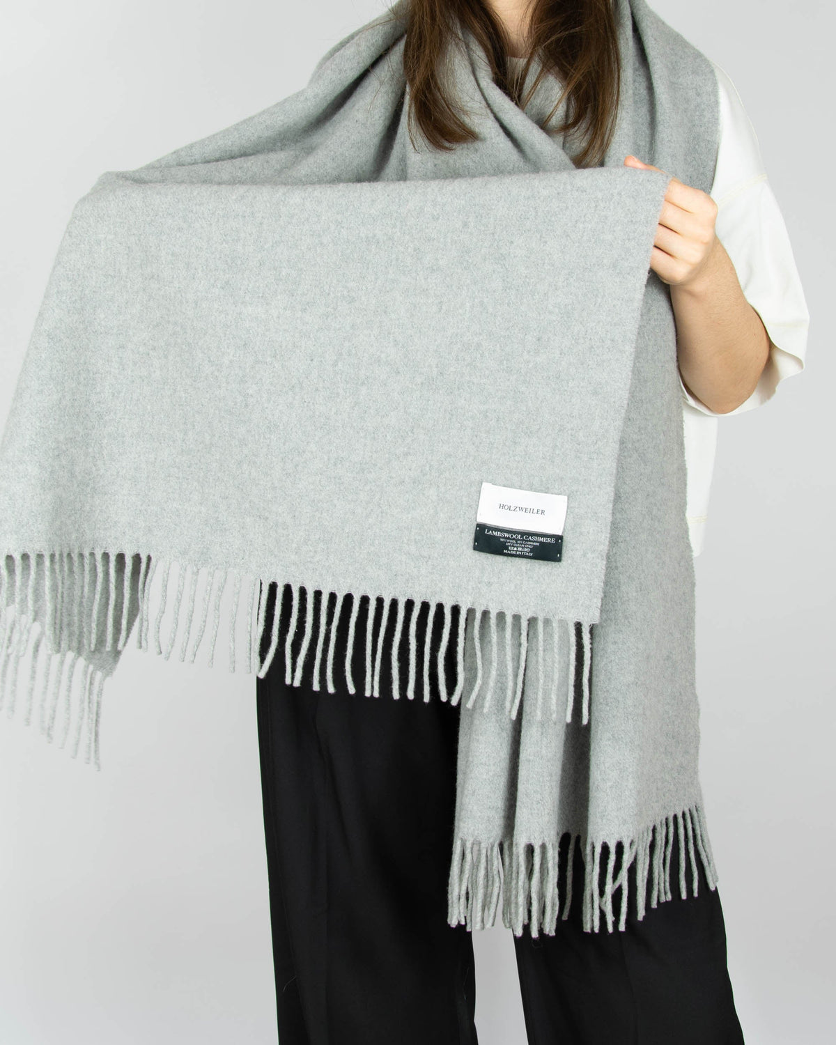 Large, cosy grey lambswool and cashmere scarf by Norwegian designer brand Holzweiler. Made in Italy.