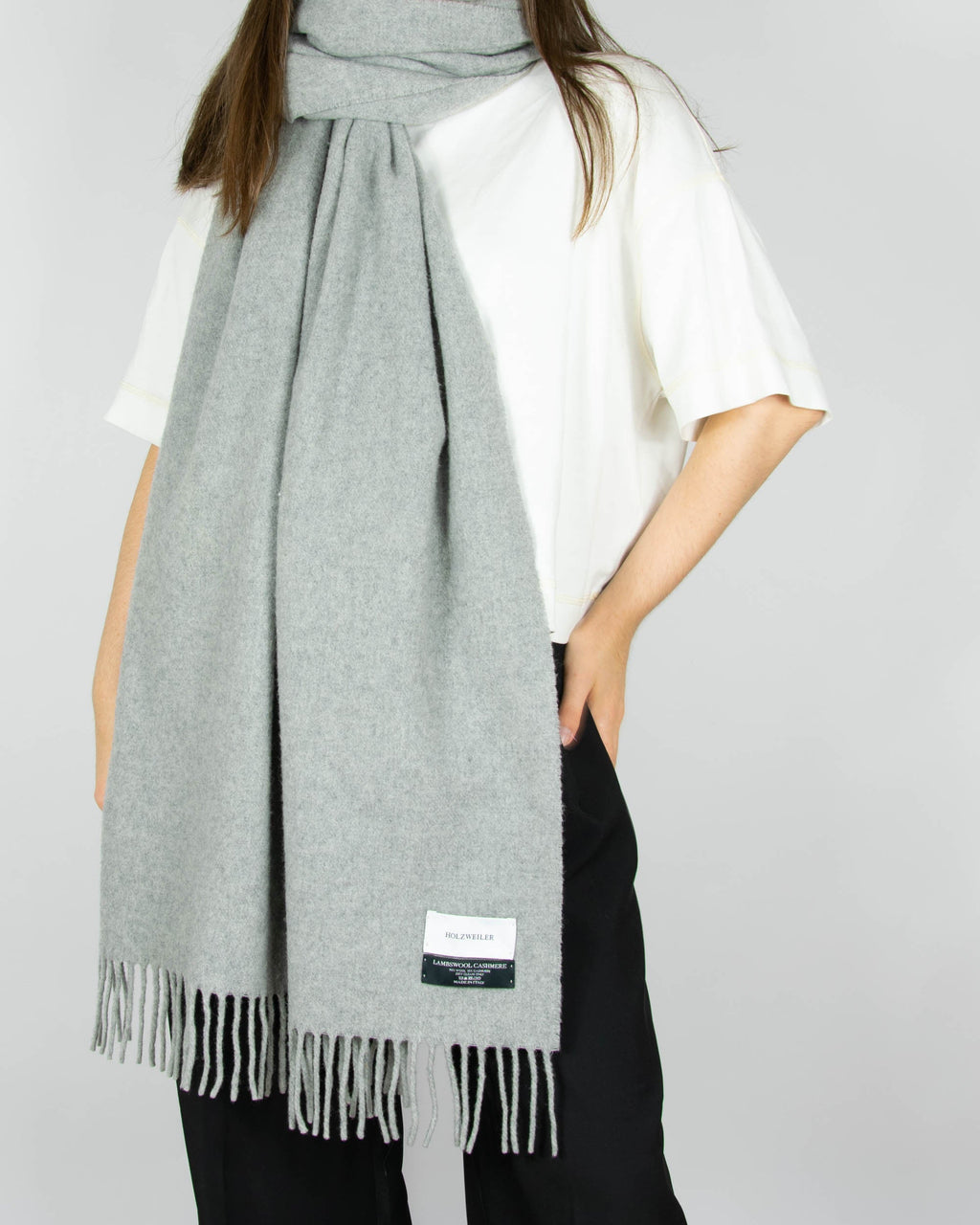 Large, cosy grey lambswool and cashmere scarf by Norwegian designer brand Holzweiler. Made in Italy.