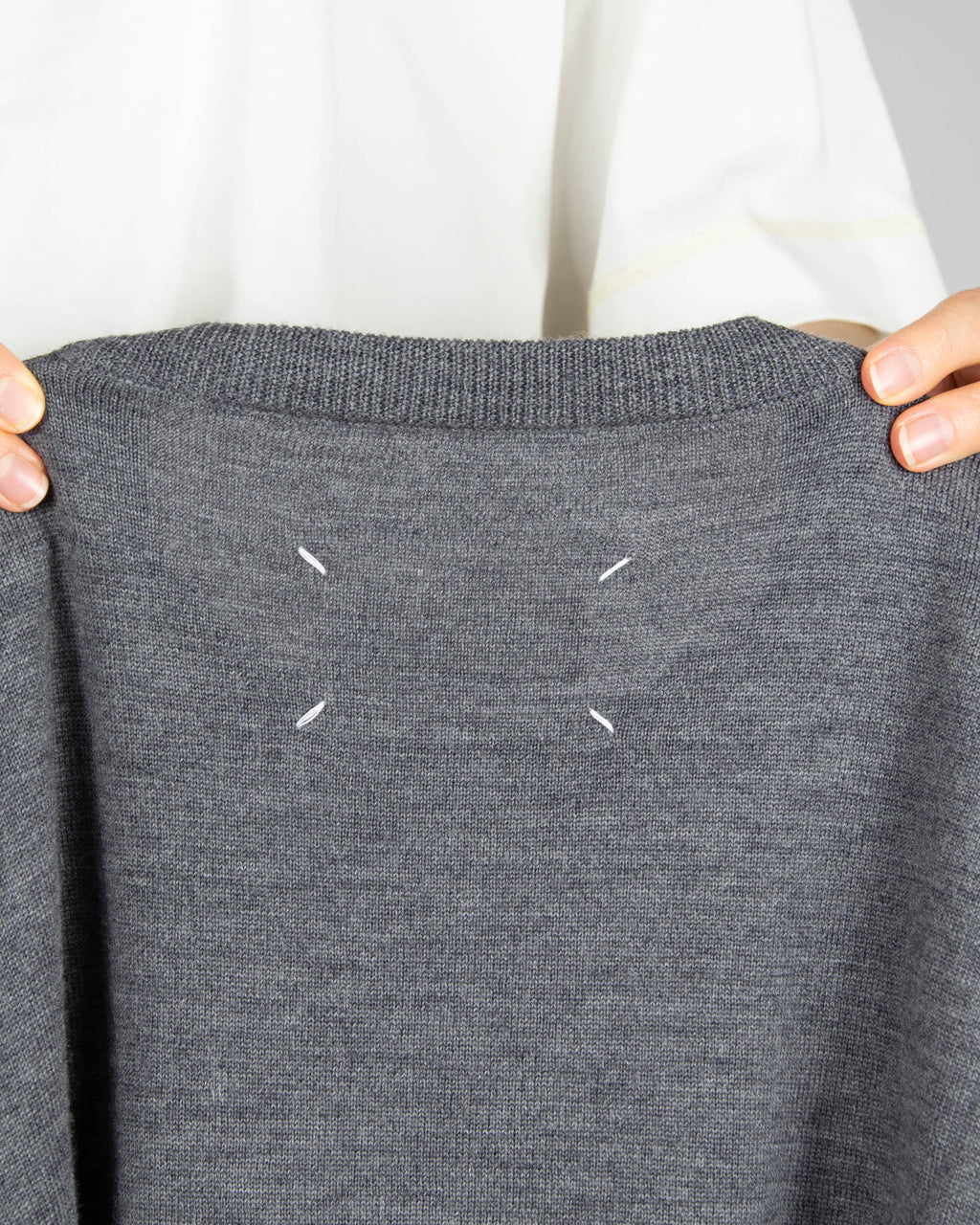 Grey and navy wool cardigan by luxury brand Maison Margiela