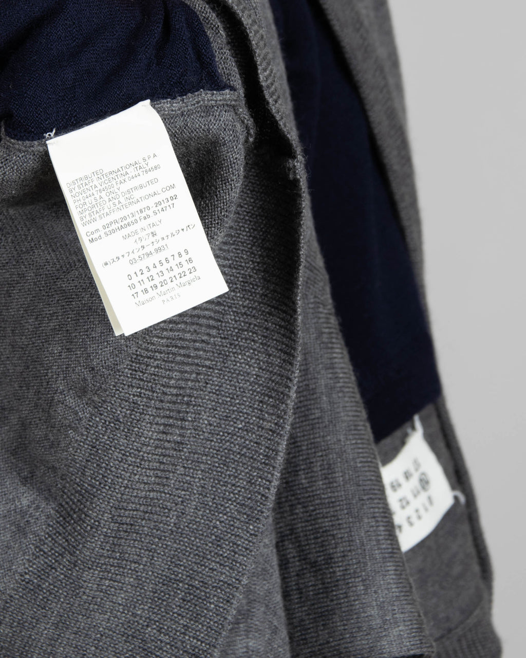 Grey and navy wool cardigan by luxury brand Maison Margiela