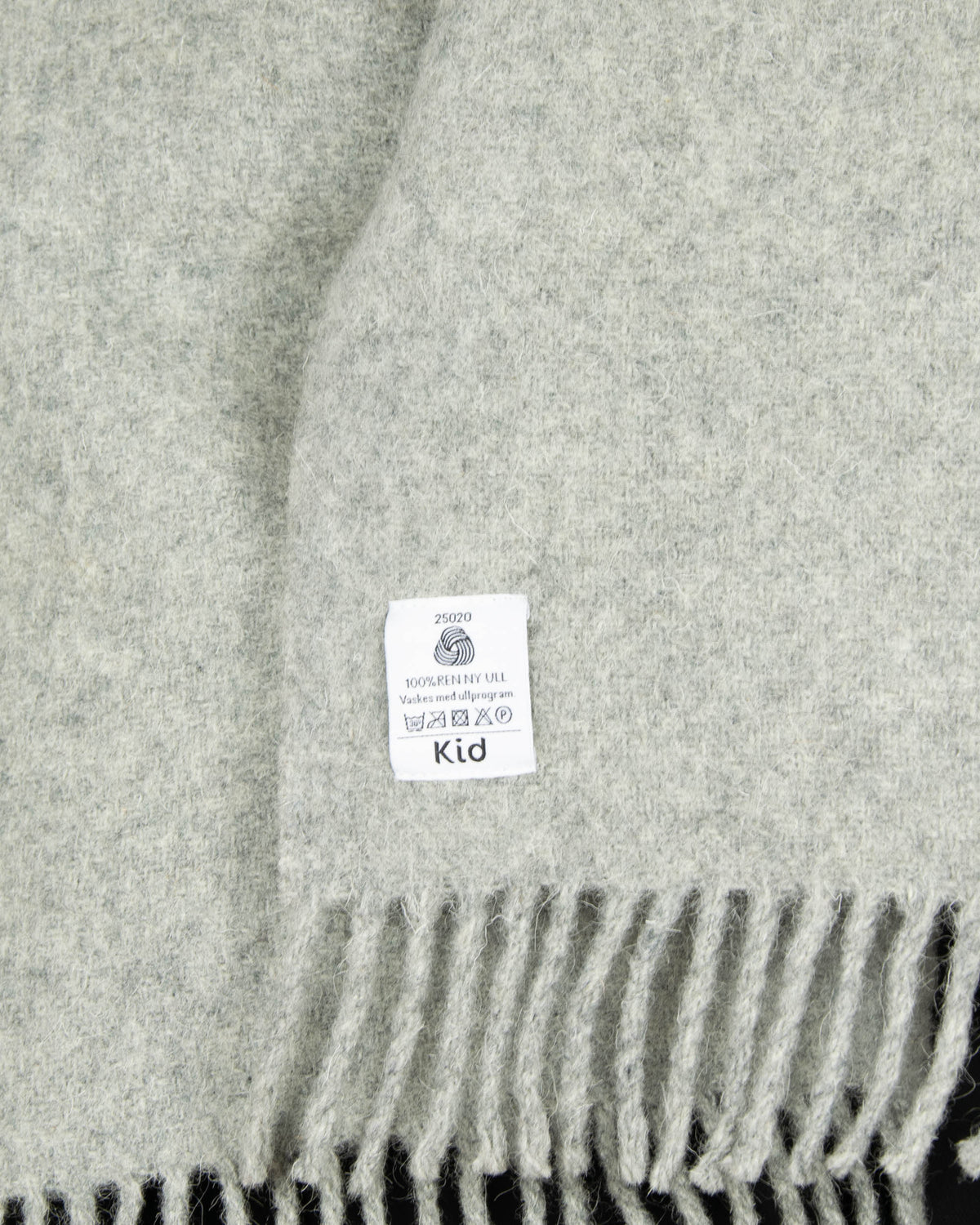 Grey pure new wool blanket by KID. Woolmark-certified. Washed and ready to keep you warm on cold evenings.