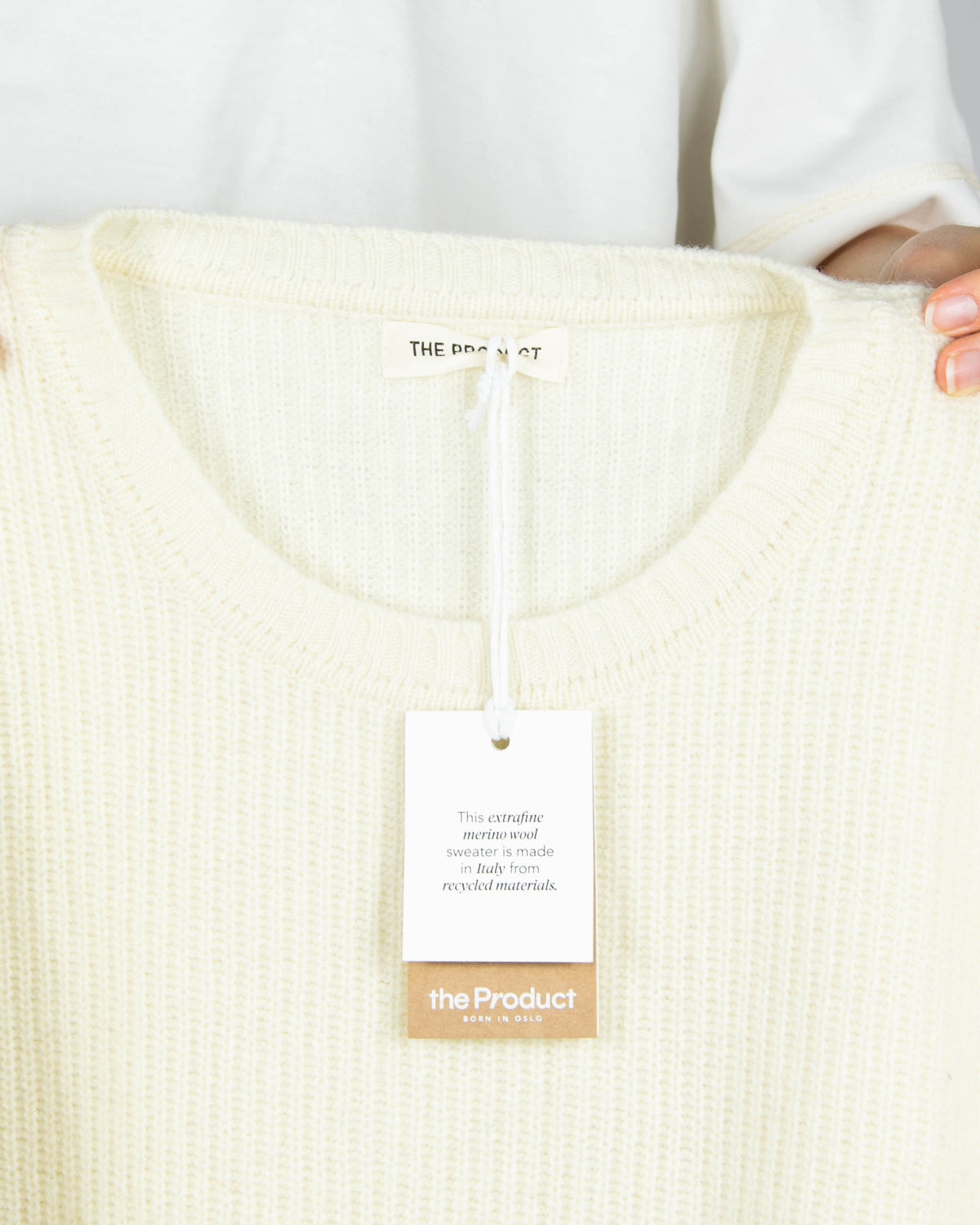 Cream extrafine merino wool sweater by Norwegian brand THE PRODUCT. Regular price: 2300 NOK (~970 PLN).