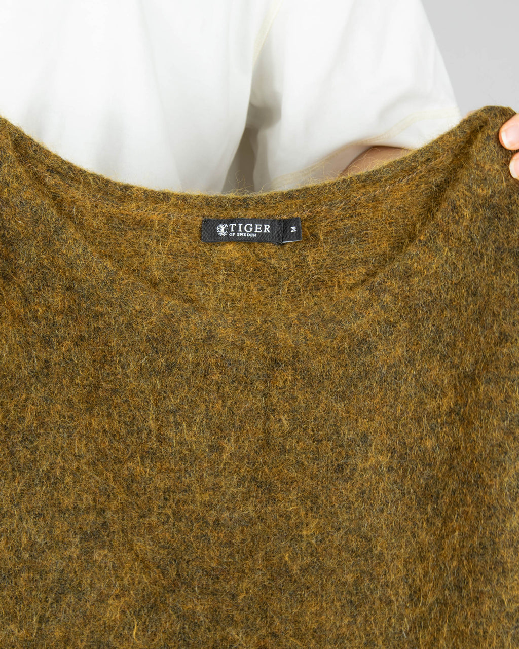 Dark khaki green fluffy mohair and wool sweater by premium brand Tiger of Sweden.