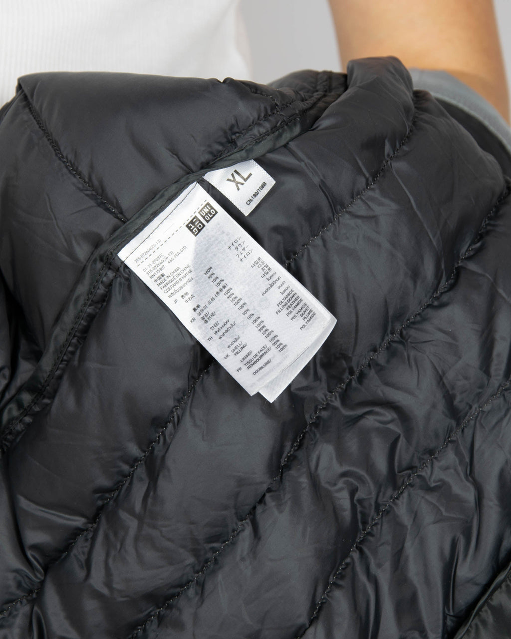 Light grey silver lightweight down jacket by Uniqlo