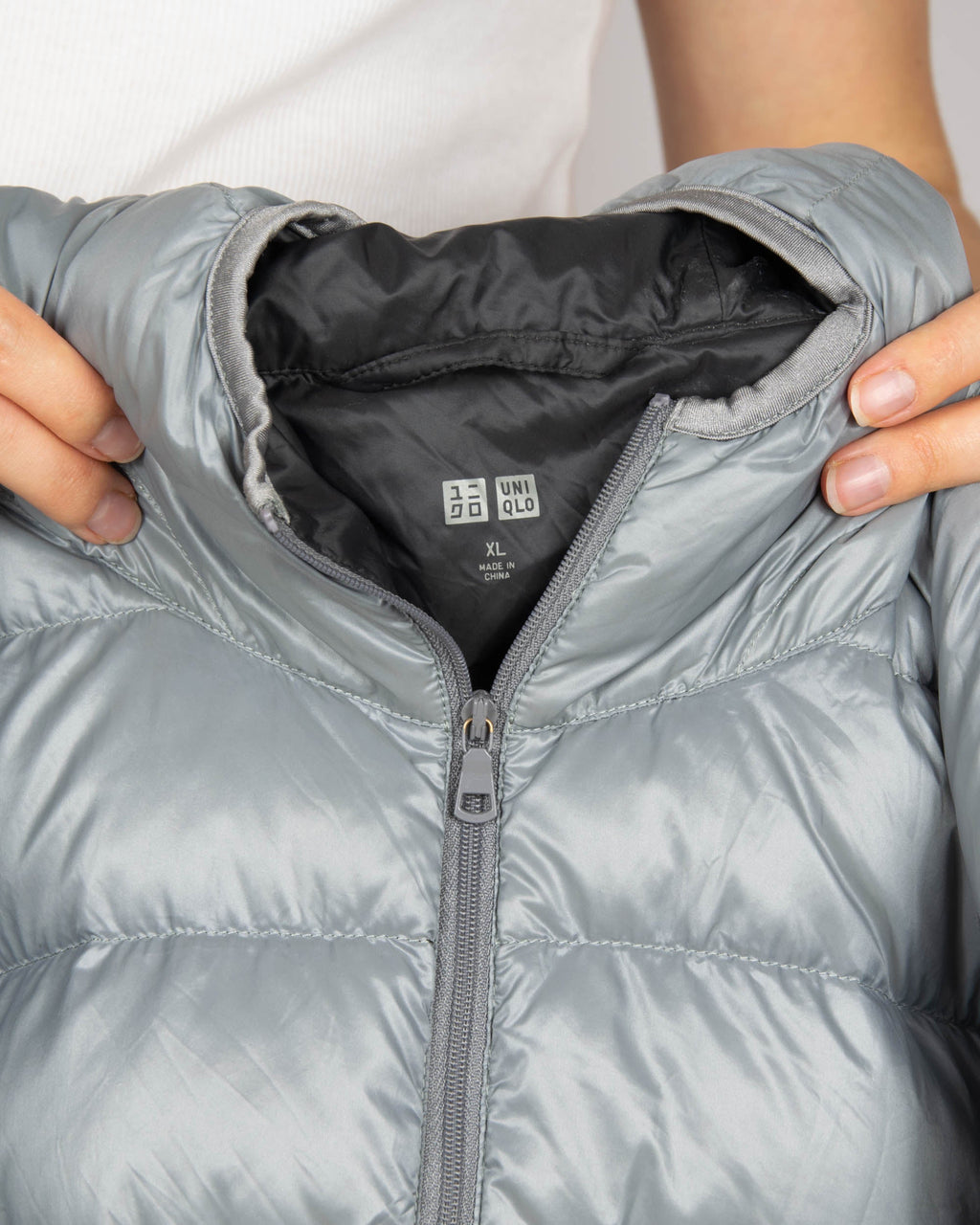 Light grey silver lightweight down jacket by Uniqlo