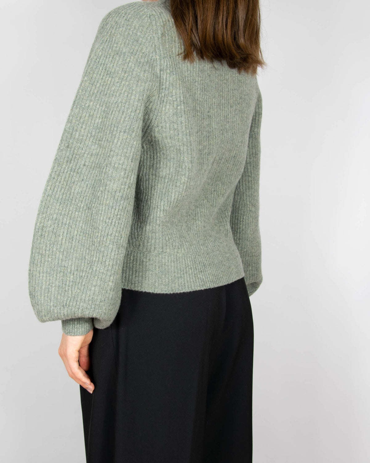 Green wool sweater with puff sleeves by Uniqlo